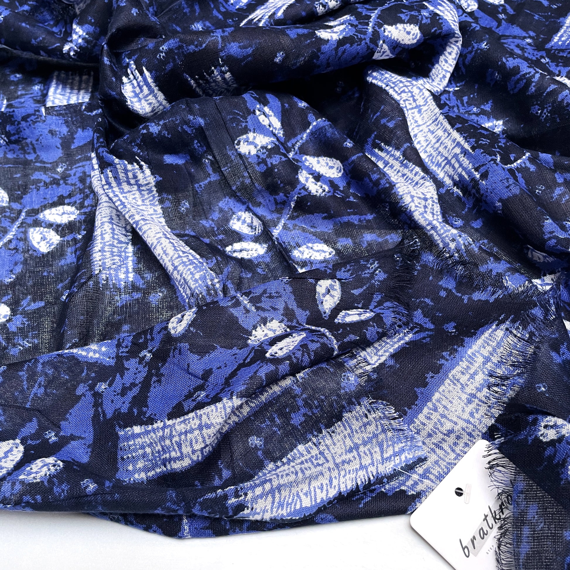 
Cotton Rayon scarf texture close-up showing navy blue colored stole with florals
